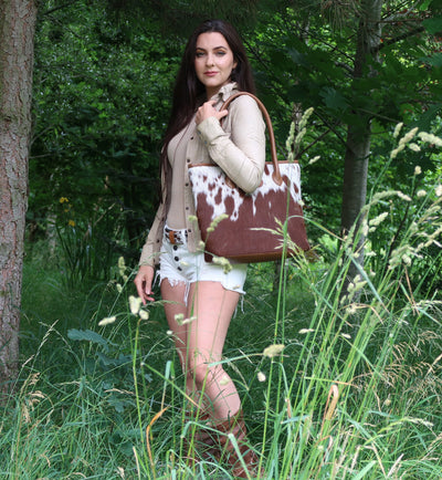Charlotte style the Upton Cowhide Handbag in Tan with a casual look